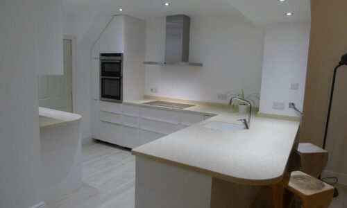 Large Tristone Kitchen with Waterfall Breakfast Bar