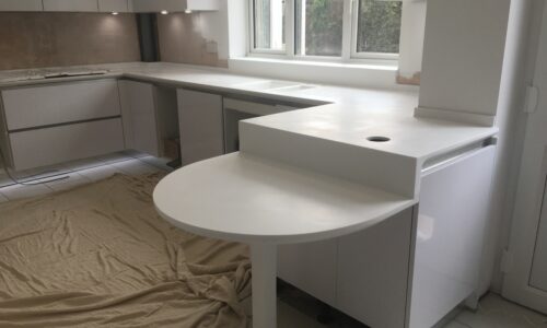 White Countertop with Curved Breakfast Bar